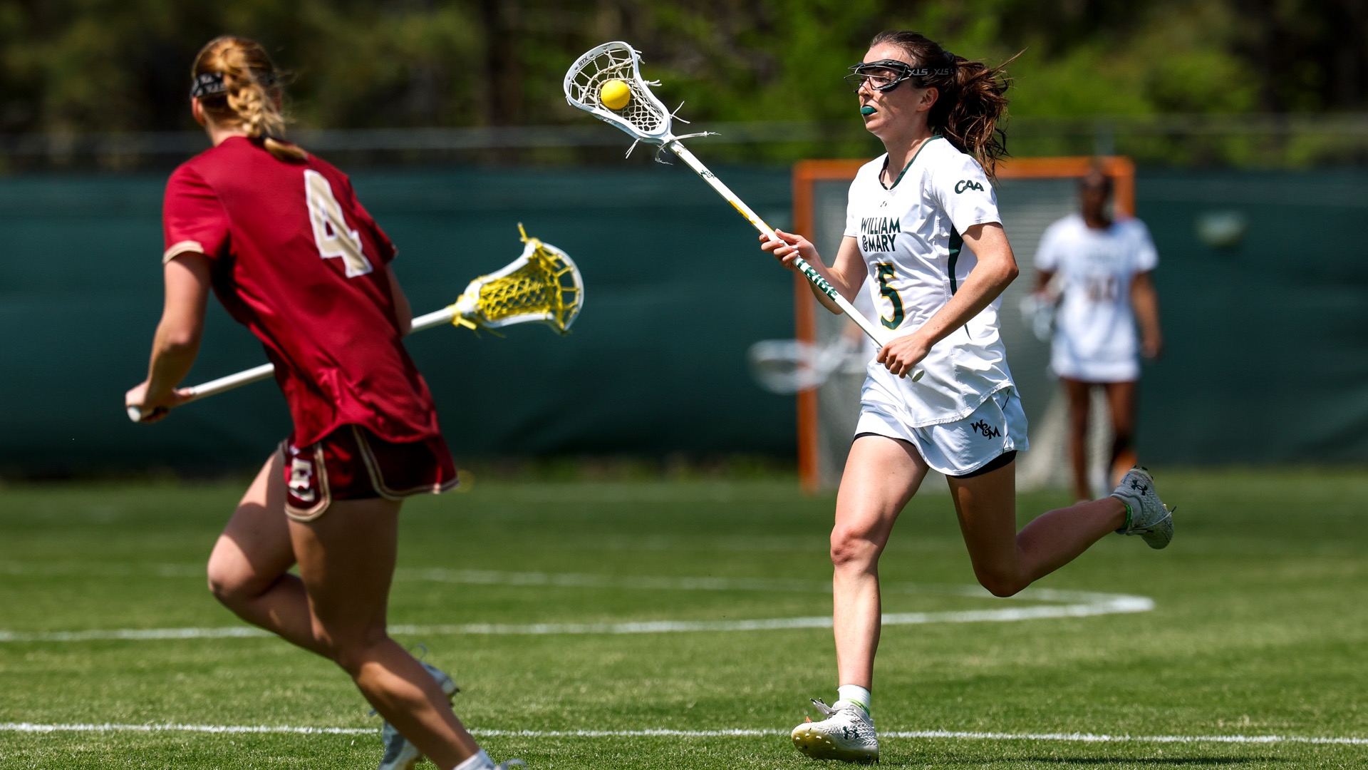 Kate Draddy runs down the field with the ball at Martin Family Stadium