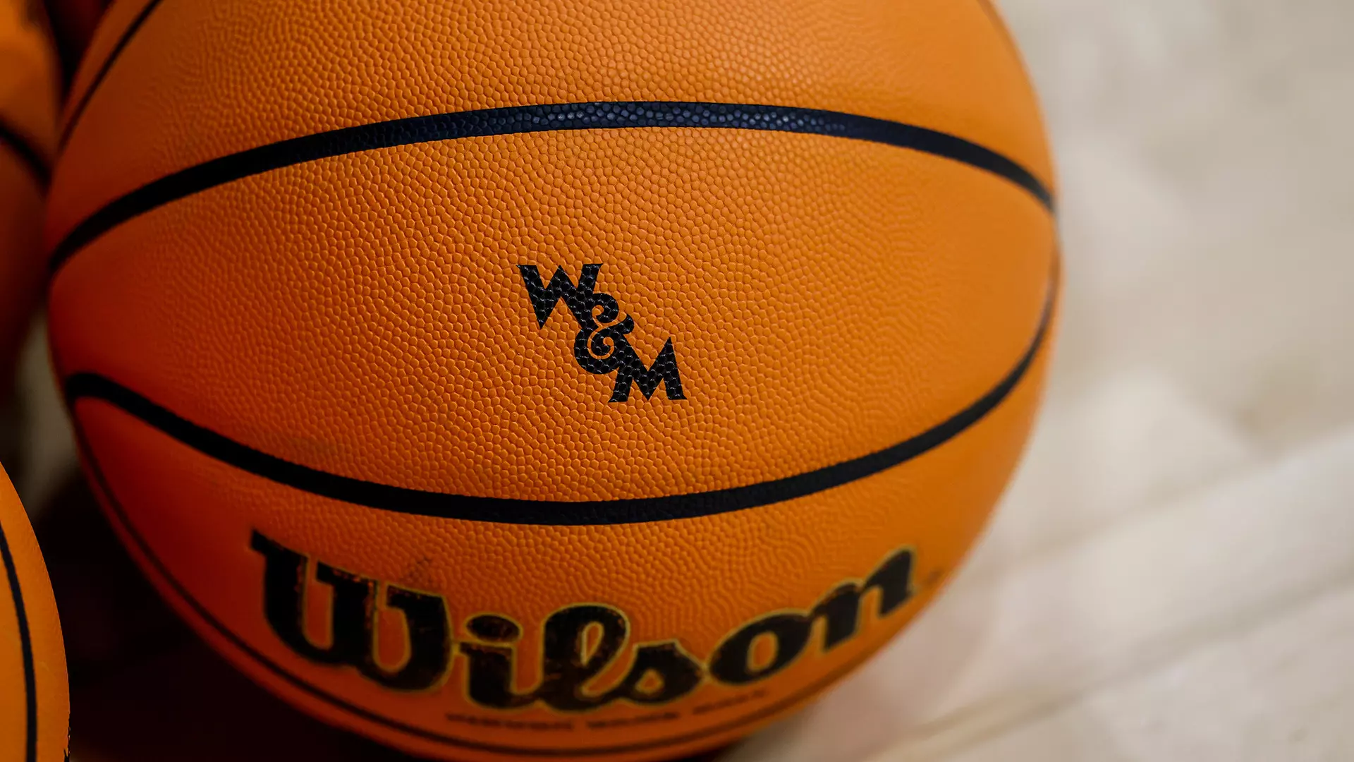 Photo of a basketball with the W&M logo on it