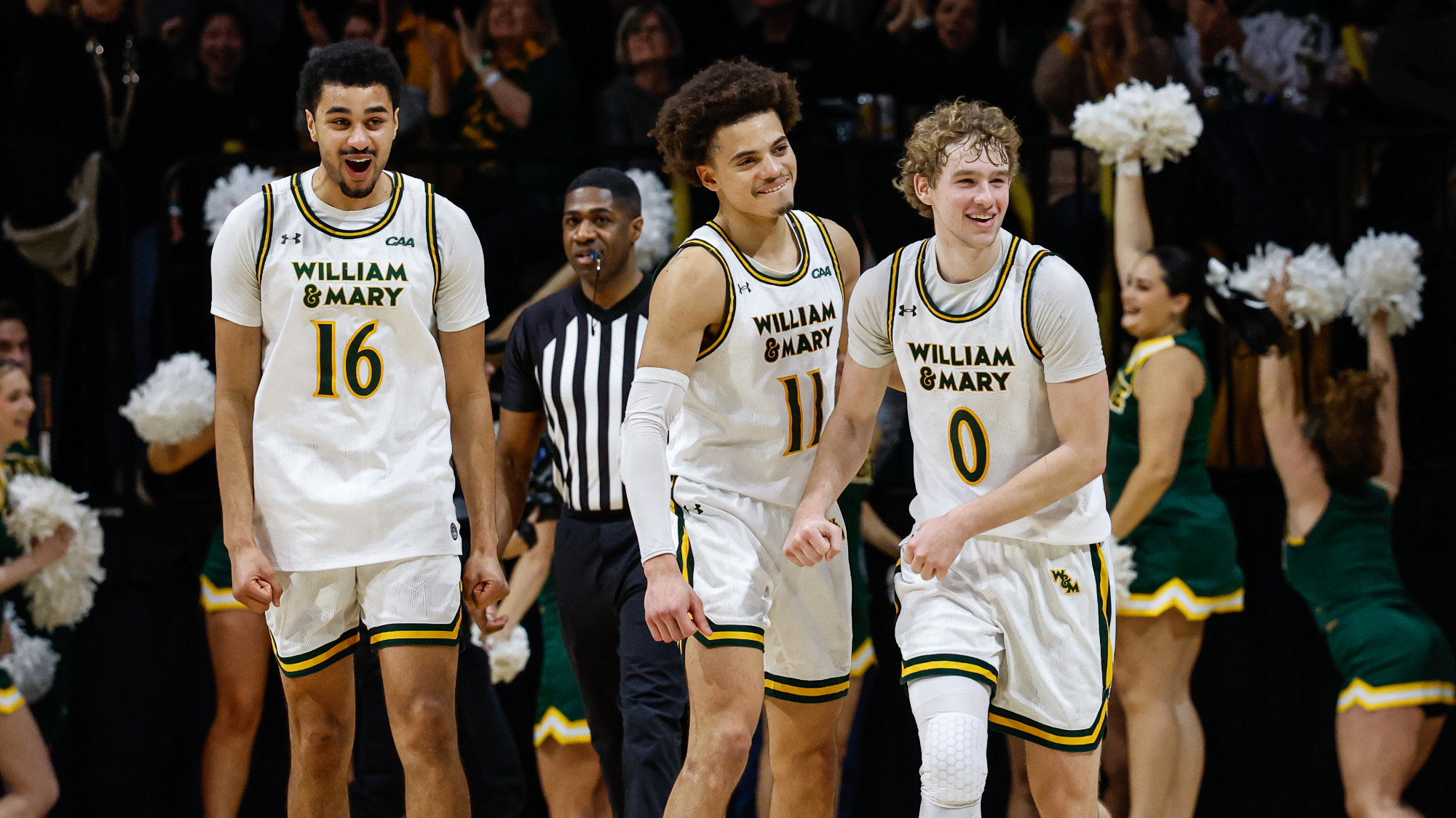 Tunde Vahlberg Fasasi, Reese Miller, and Kyle Pulliam celebrate a big play going into a timeout of its win over Hofstra. 