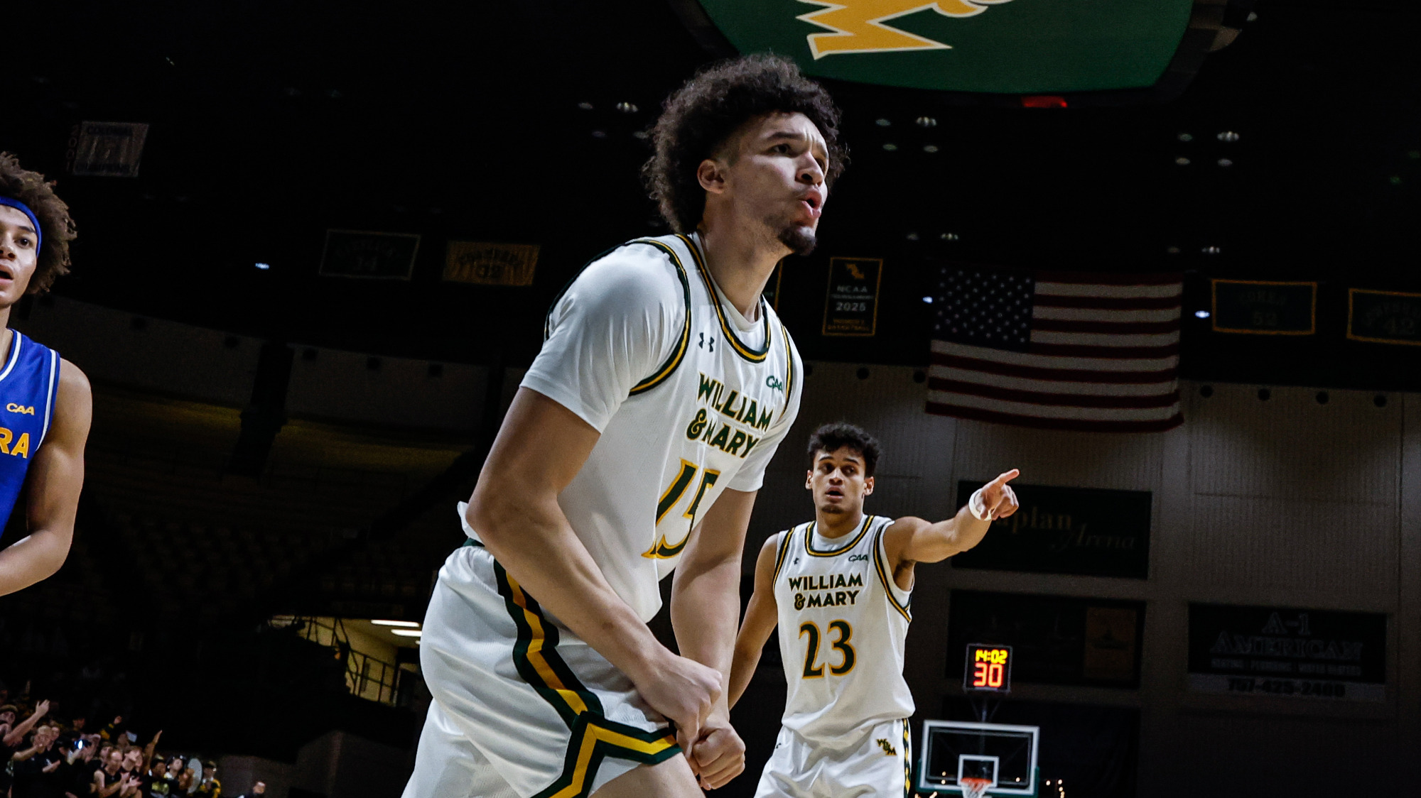 Ryan Jackson, Jr. flexes and shouts in celebration after a big play in the Tribe's win over Hofstra on Jan. 24, 2026. 