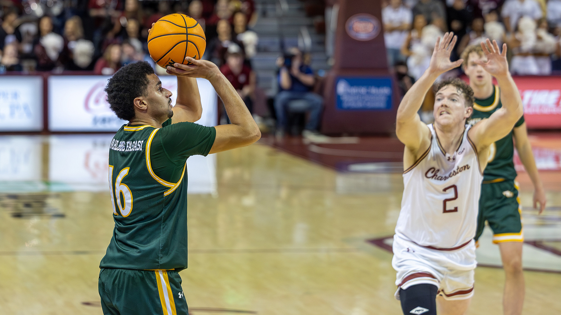  Tunde Vahlberg Fasasi lines up a 3-pointer from the corner in the Tribe's game at Charleston.