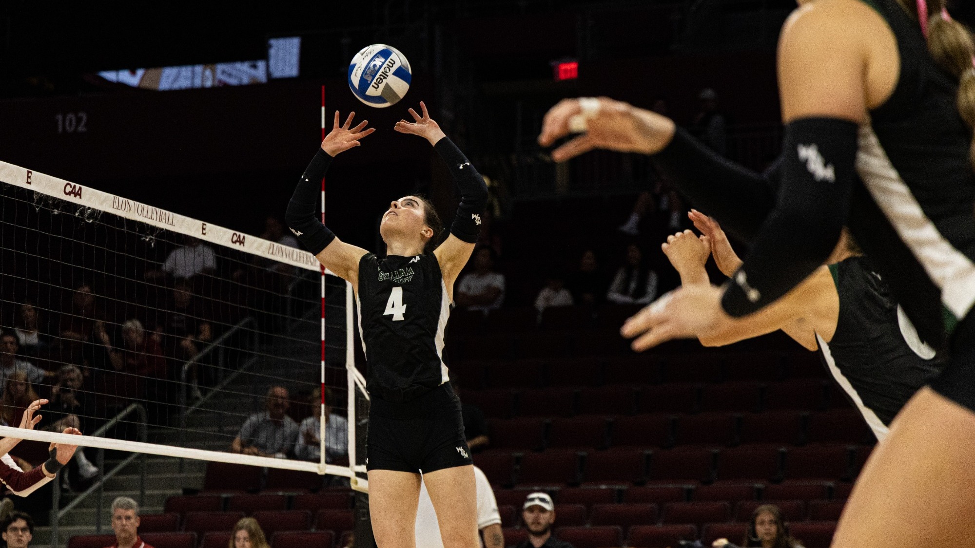 Cate Hatfield sets a ball against Elon on Oct. 16, 2026 at the Schar Center.