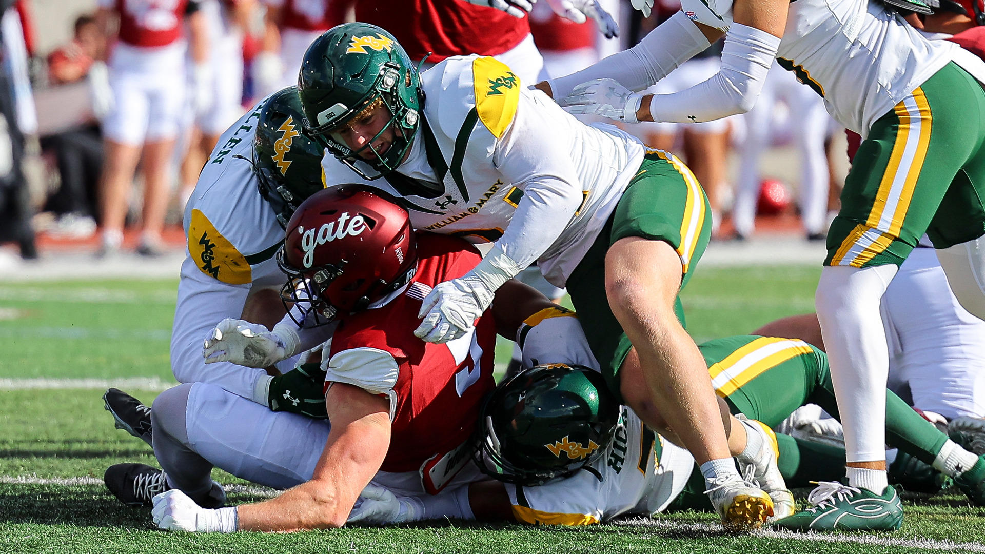 A group of W&M players combine to make a tackle vs. Colgate