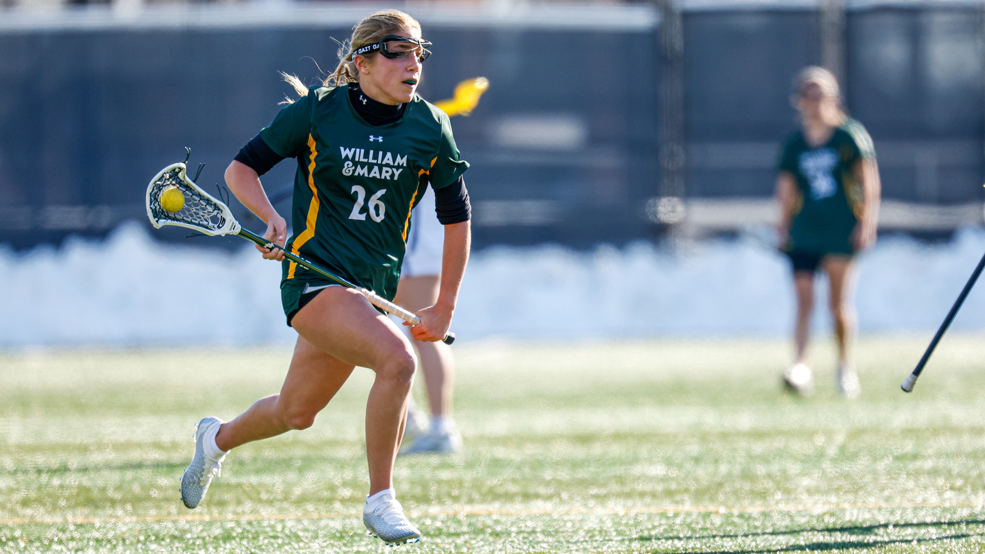 Mila Millhouse runs down the field with the ball during a game at George Washington