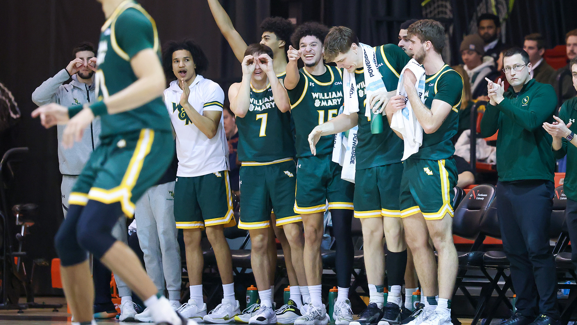 The Tribe bench celebrates a big play in the road win at Northeastern. 