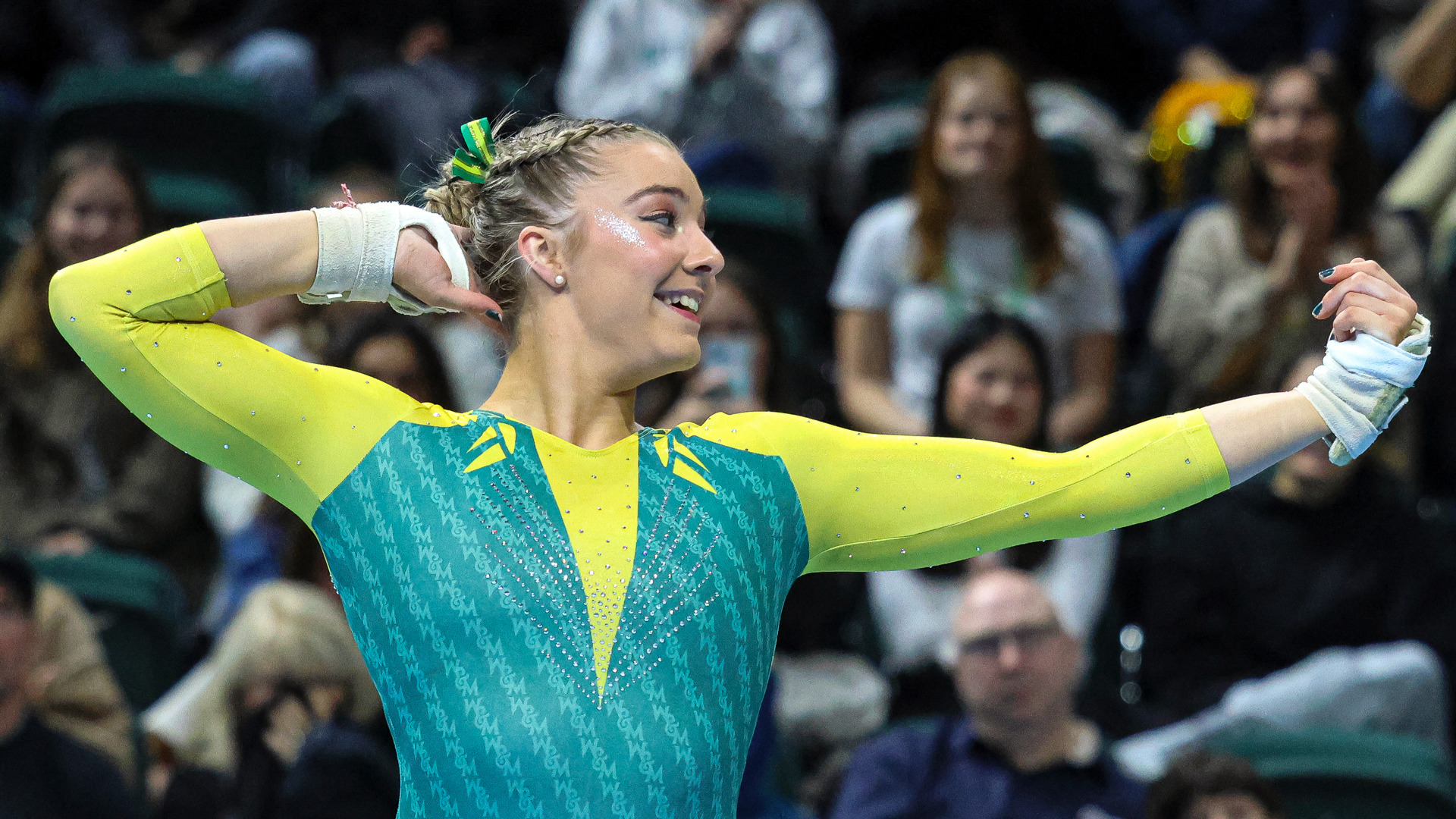 Hannah Burke competes on floor during a meet at Kaplan Arena