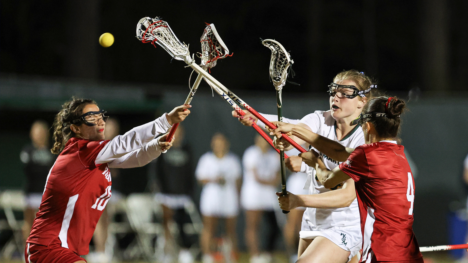 A W&M lacrosse player takes a shot against Richmond