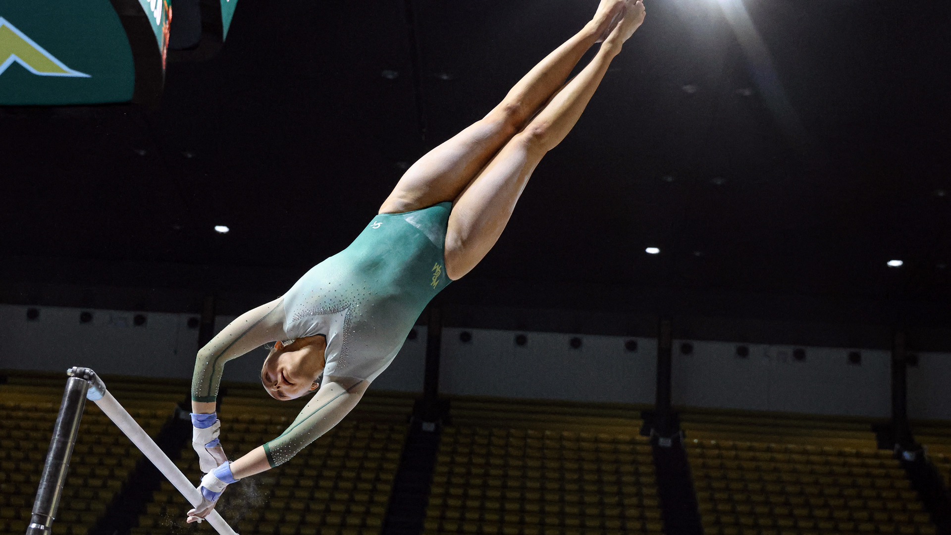 Catherine Bare competes on bars at Kaplan Arena