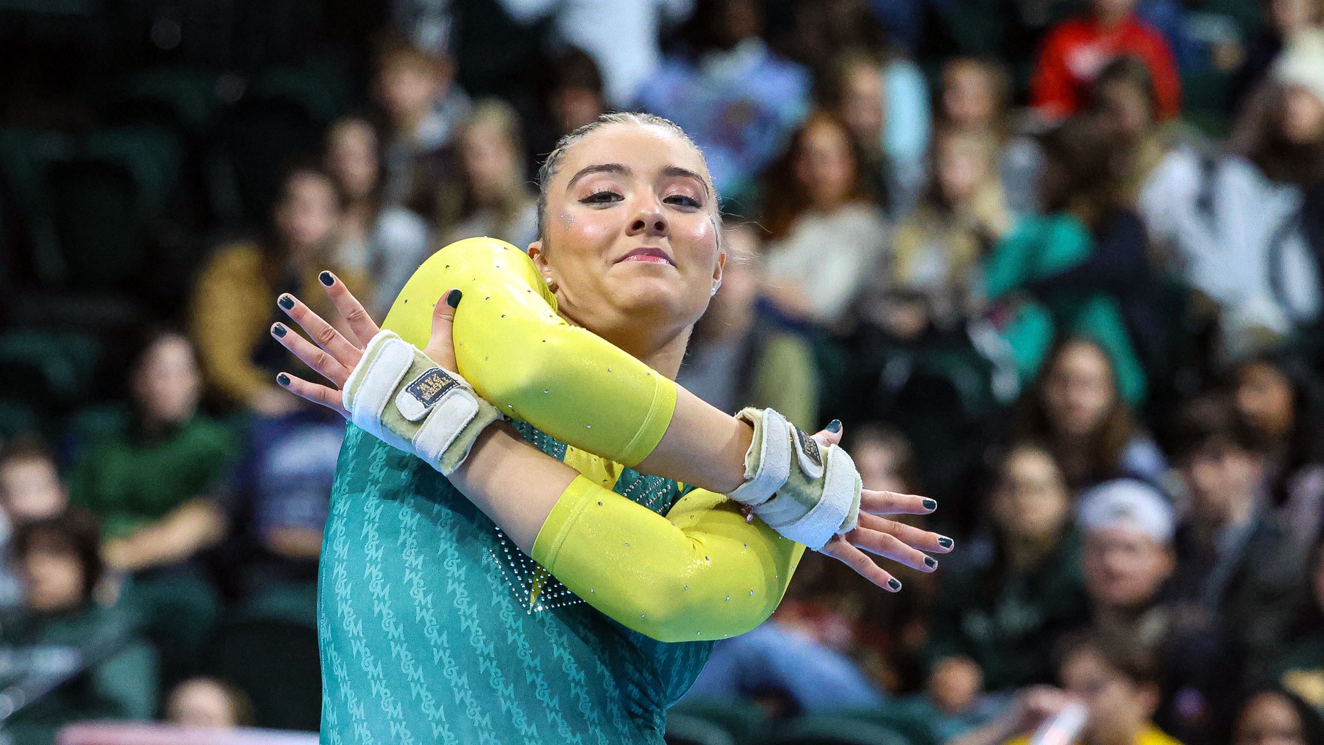 Hannah Burke competes on floor during a meet at Kaplan Arena