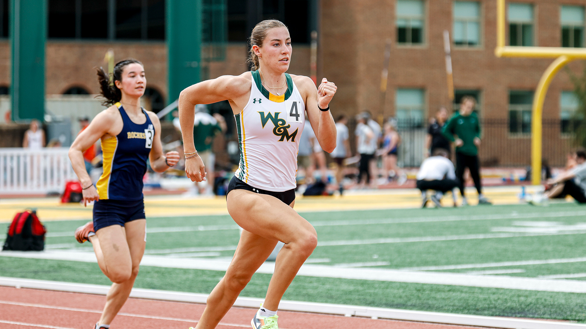 Avery Glidden runs down the back stretch during a hurdles even at the Colonial Relays in 2025. 