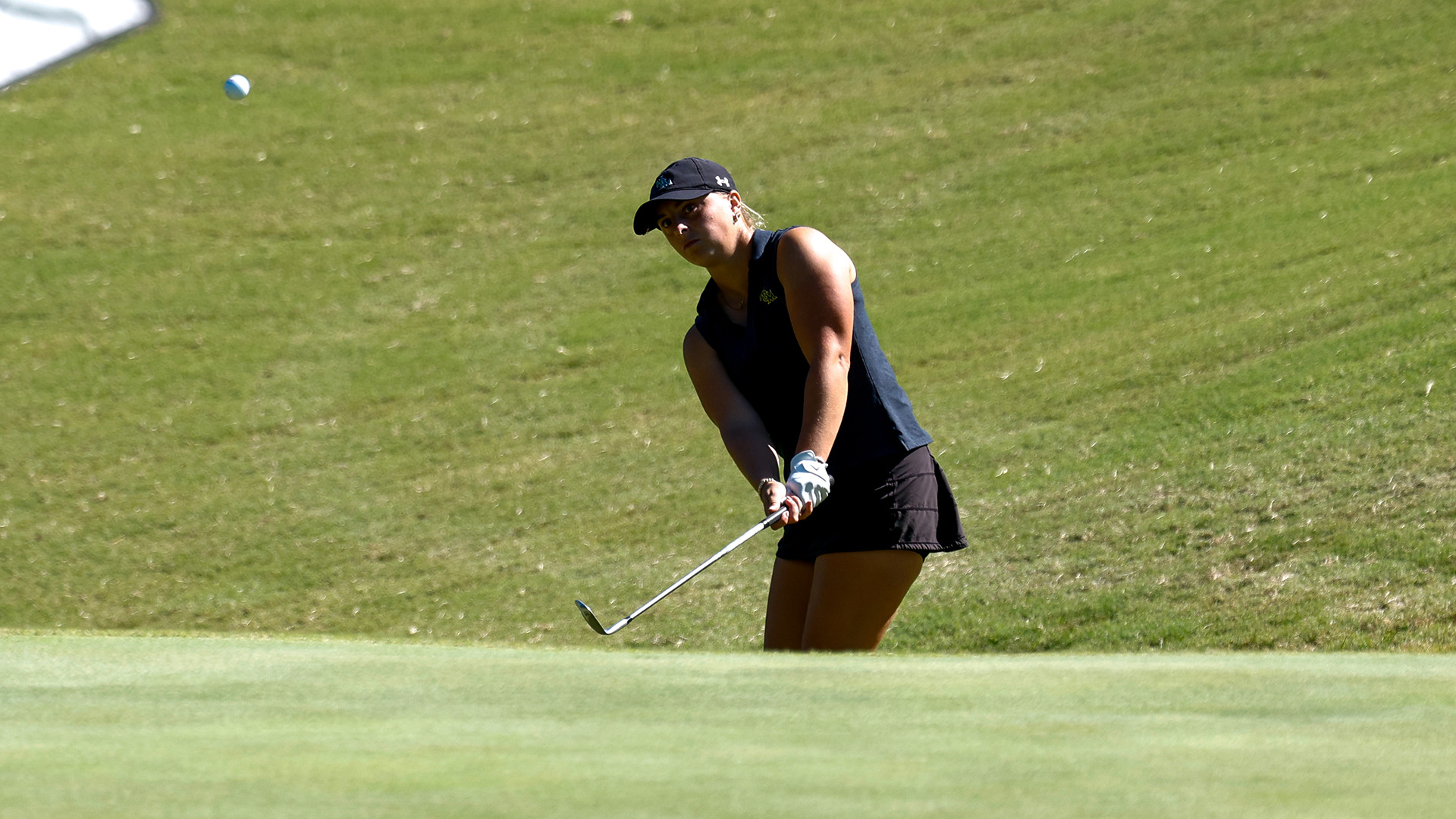 Samantha Skinner hits a chip shot from off the green at the Tribe Invitational, which was played at the Kingsmill Golf Resort.