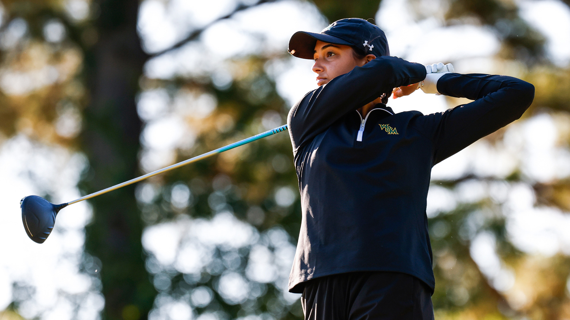 Jennifer Osborne stares down her shot after following through on her back swing with the driver off a tee at the Tribe Invitational. 