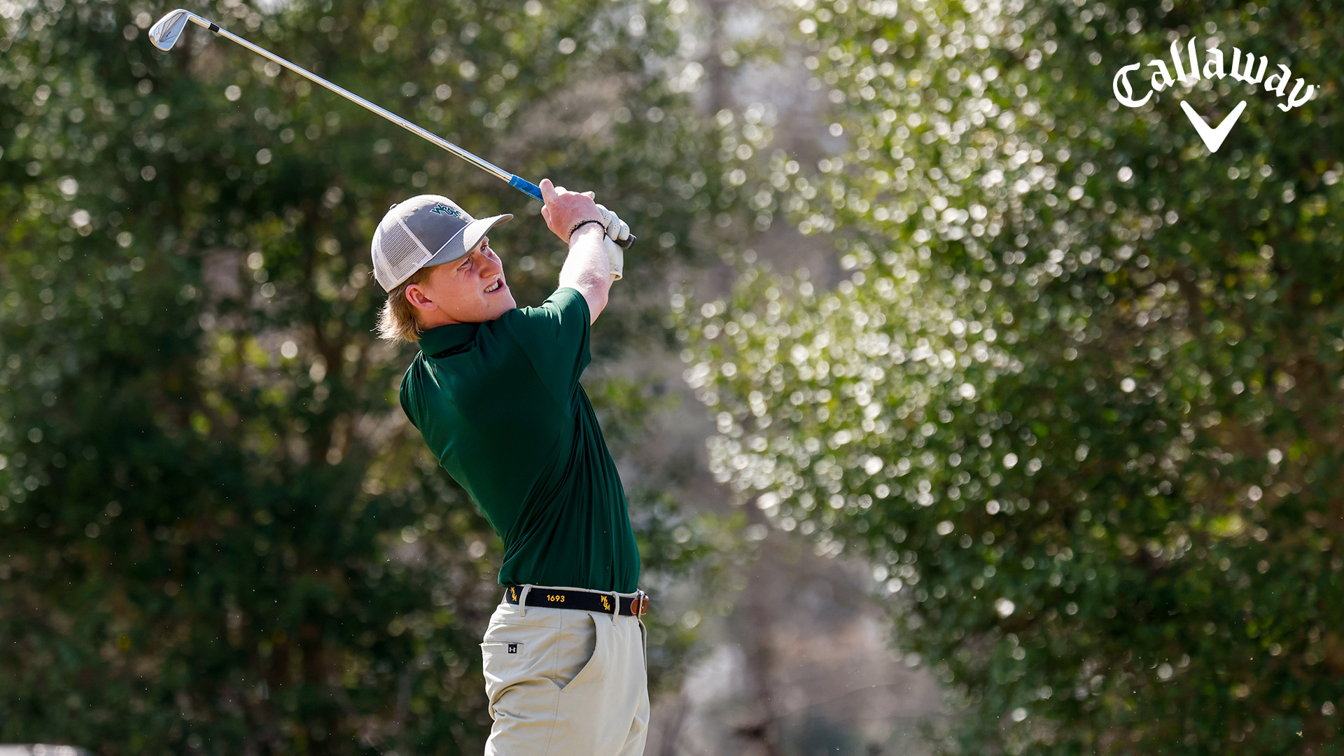 Talon Dingledine follows through with an iron from from the fairway, staring down his shot at the Golden Horseshoe Intercolleigate.