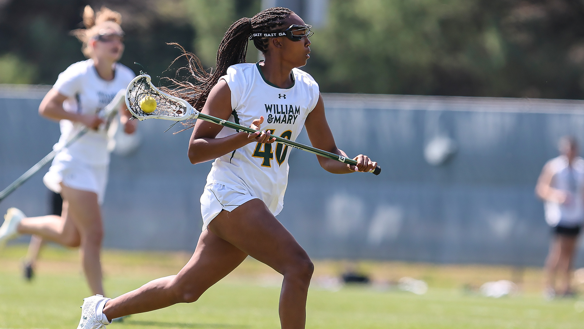 Jaylin Locke runs down the field with a ball during a game at Martin Family Stadium