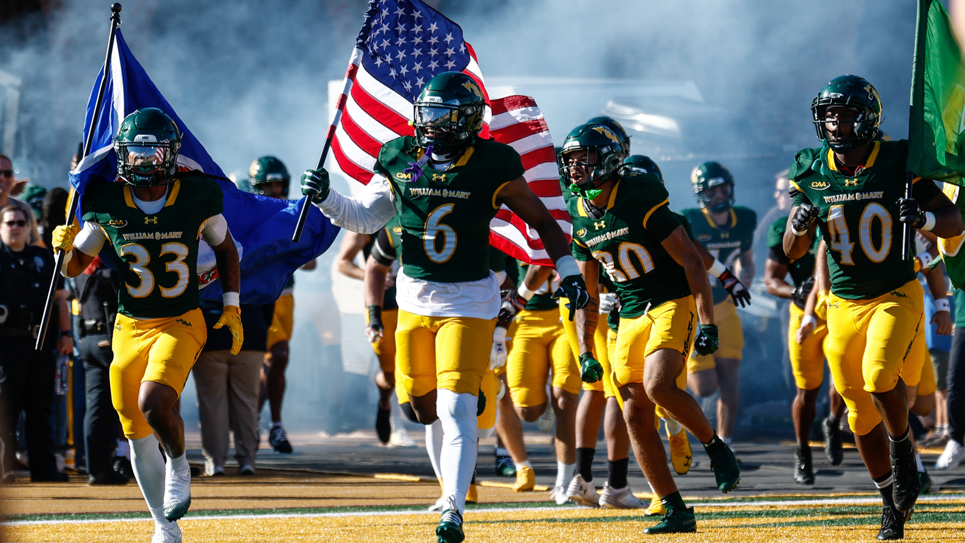 Elijah Rainer runs on the field prior to a home football game at Zable Stadium