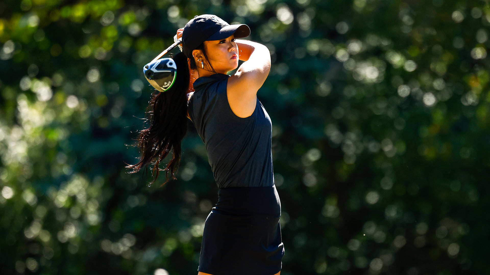 Katie Suk follows through on her backswing after hitting a driver at Tribe Invitational.