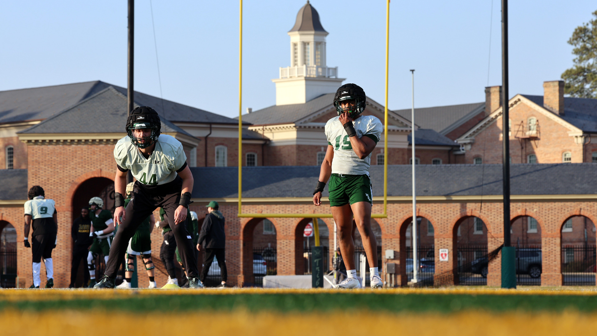 Kyle Reviello and Harrison Johnson prepare to do drill during spring football practice at Zable Stadium