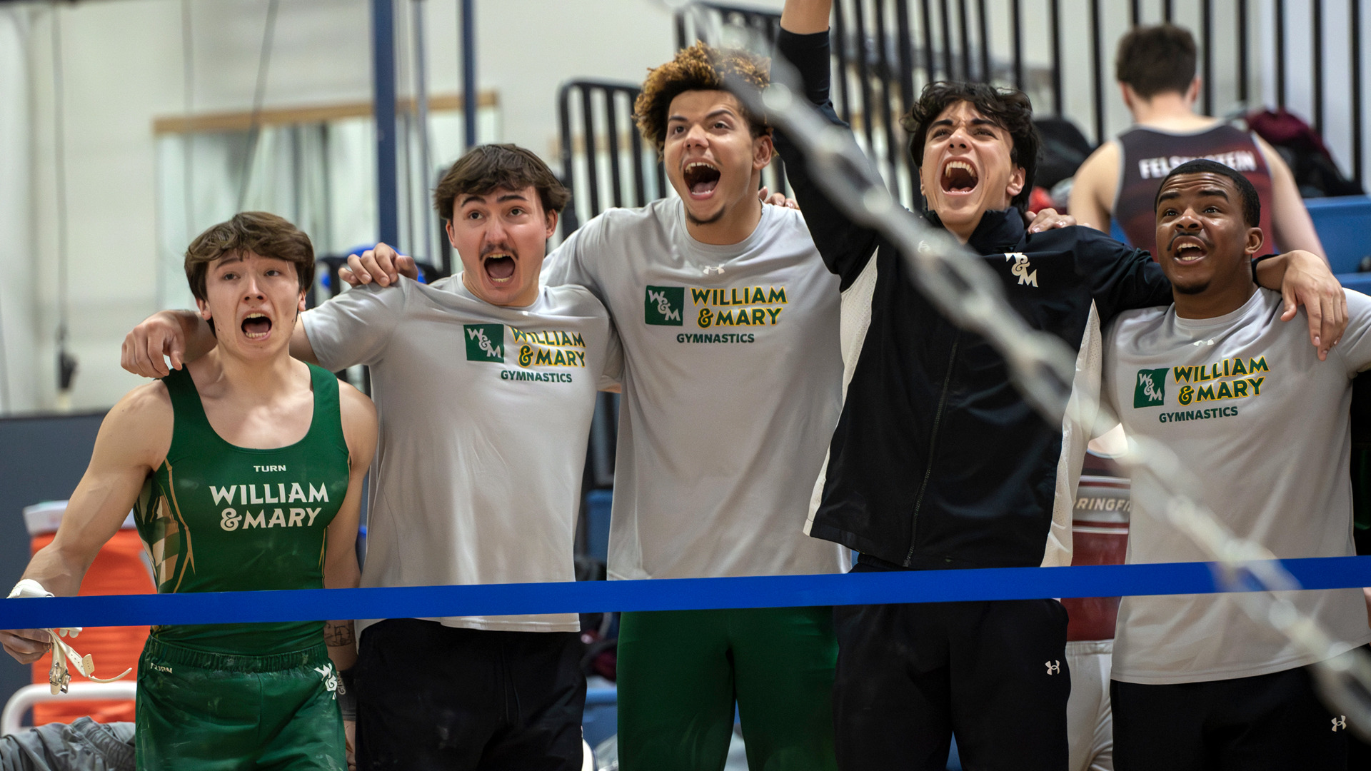 Members of the W&M men's gymnastics team celebrate during a meet at Air Force