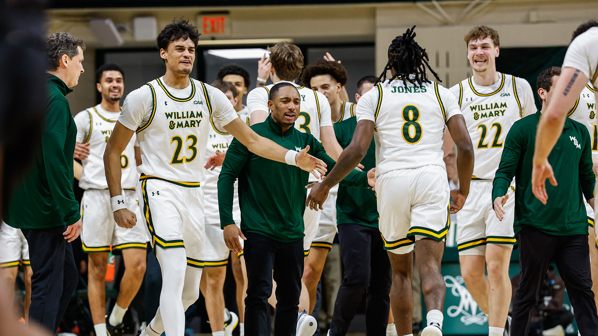 The Tribe bench rushes onto the court to celebrate with the players on the court going into a timeout. 