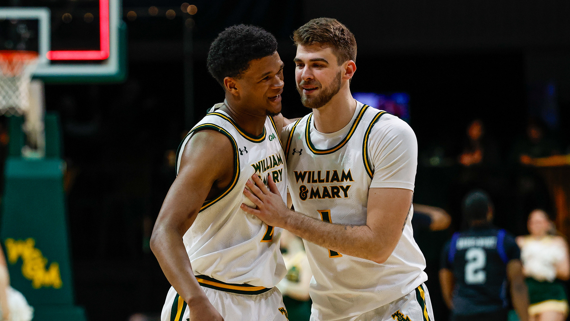 Cade Haskins pats Chase Lowe on the chest as the pair celebrates the Tribe's Senior Night win over Hampton. 