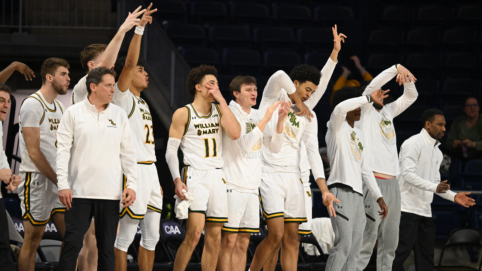 The Tribe bench reacts with excitement to a made 3-pointer in the CAA Second Round win over Elon. 