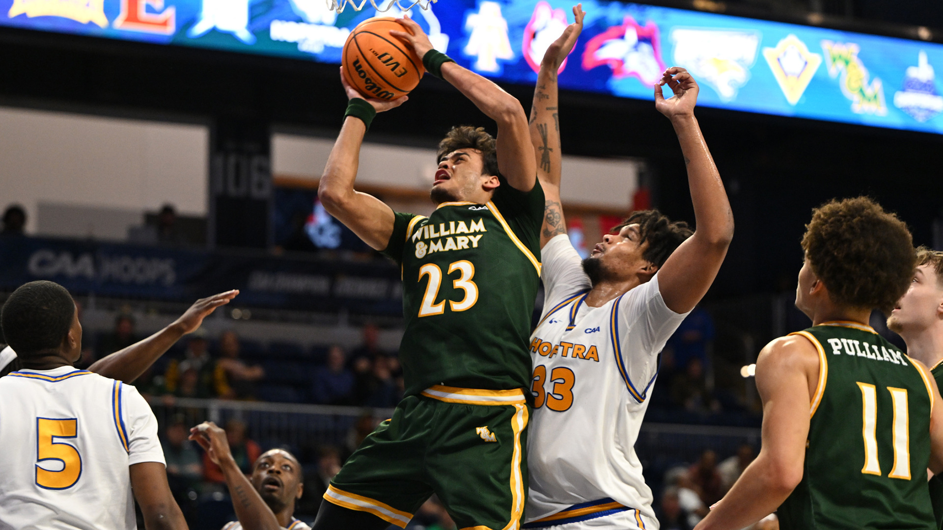 Jo'el Emanuel goes up for a lay-up with a Hofstra player on his back in the CAA Quarterfinals at CareFirst Arena.