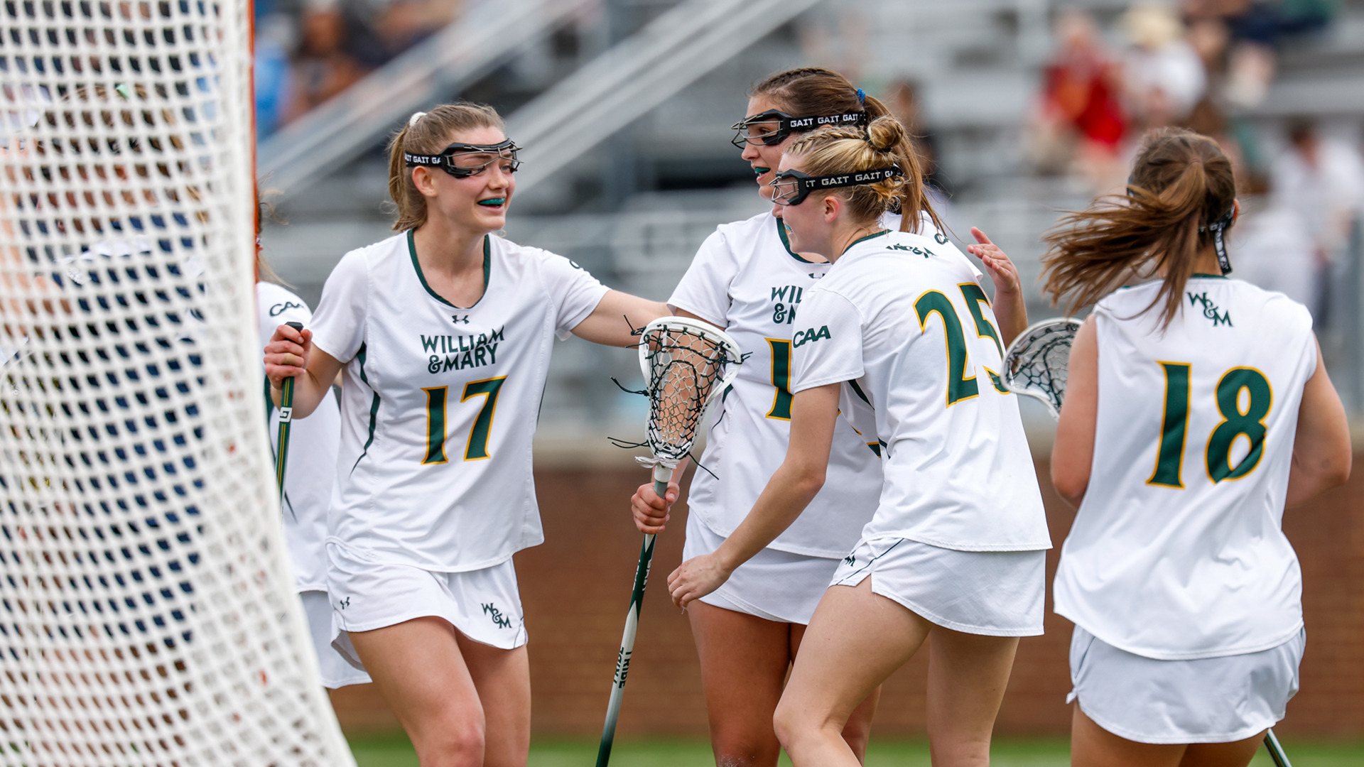 Members of W&M celebrate a goal at Martin Family Stadium