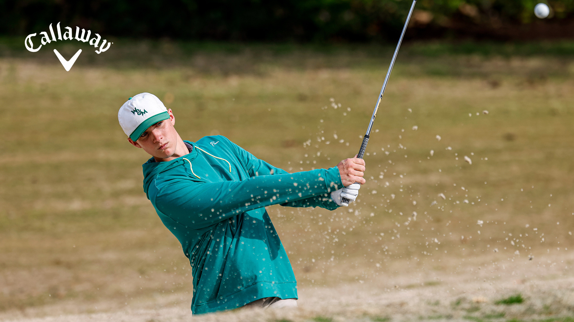 Grady Williams hits a bunker shot on the practice range ahead of the Golden Horseshoe Intercollegiate. 
