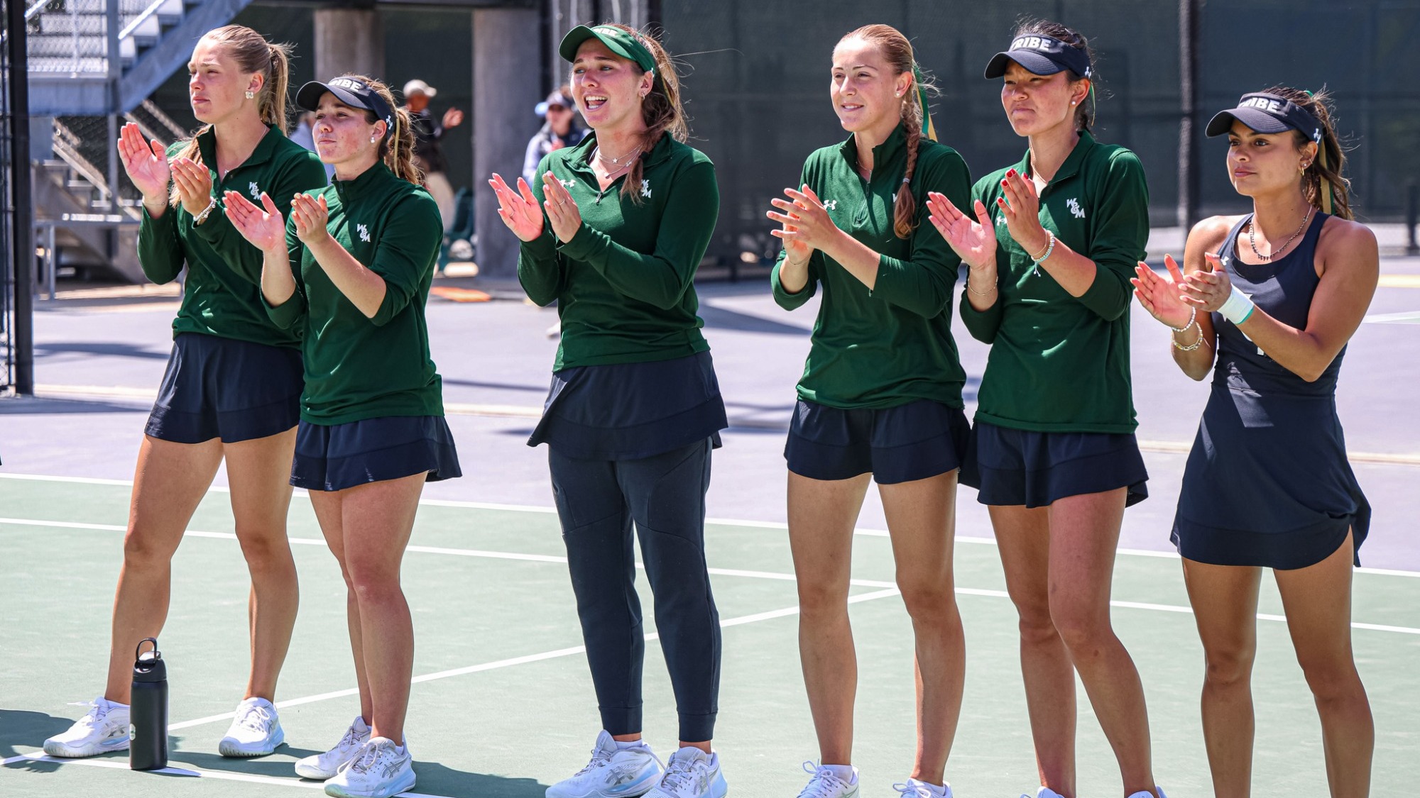 W&M women's tennis cheering on their team
