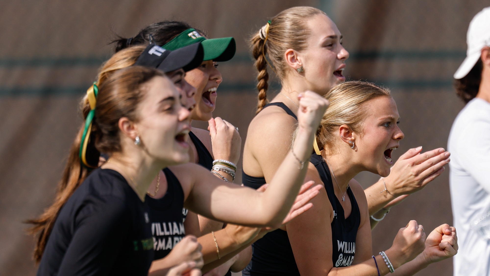 Tribe women's tennis cheering on their team