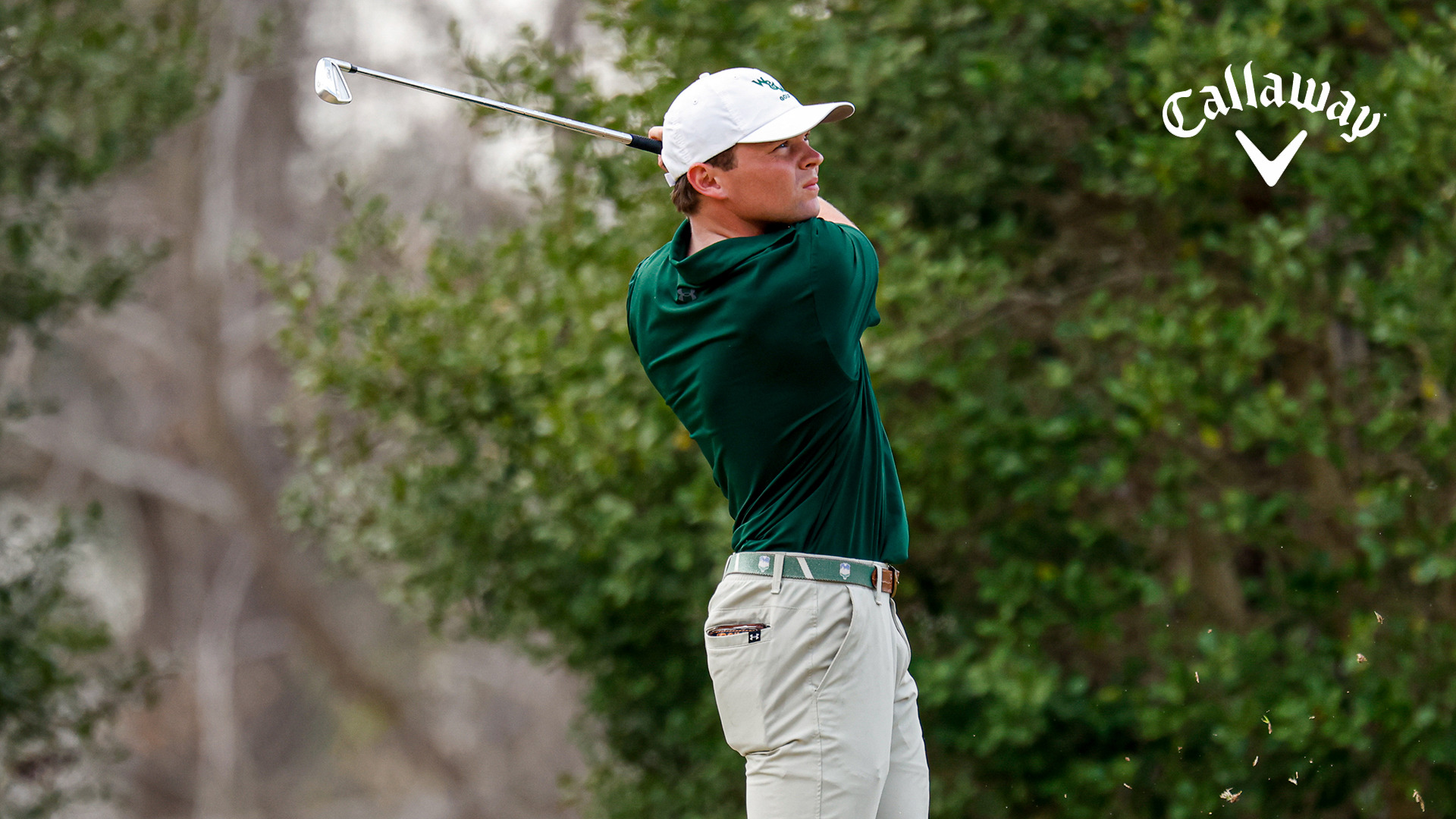Matthew Monastero hits a shot and poses in his follow through after hitting an iron off a tee during the opening round of the Golden Horseshoe Intercollegiate.