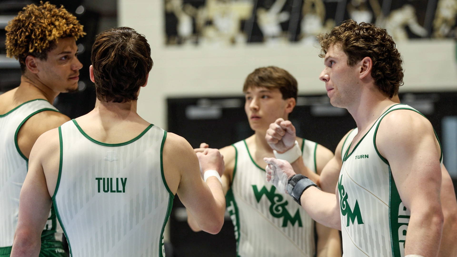 Members of the W&M men's gymnastics team huddle together during the 2026 ECAC Championship