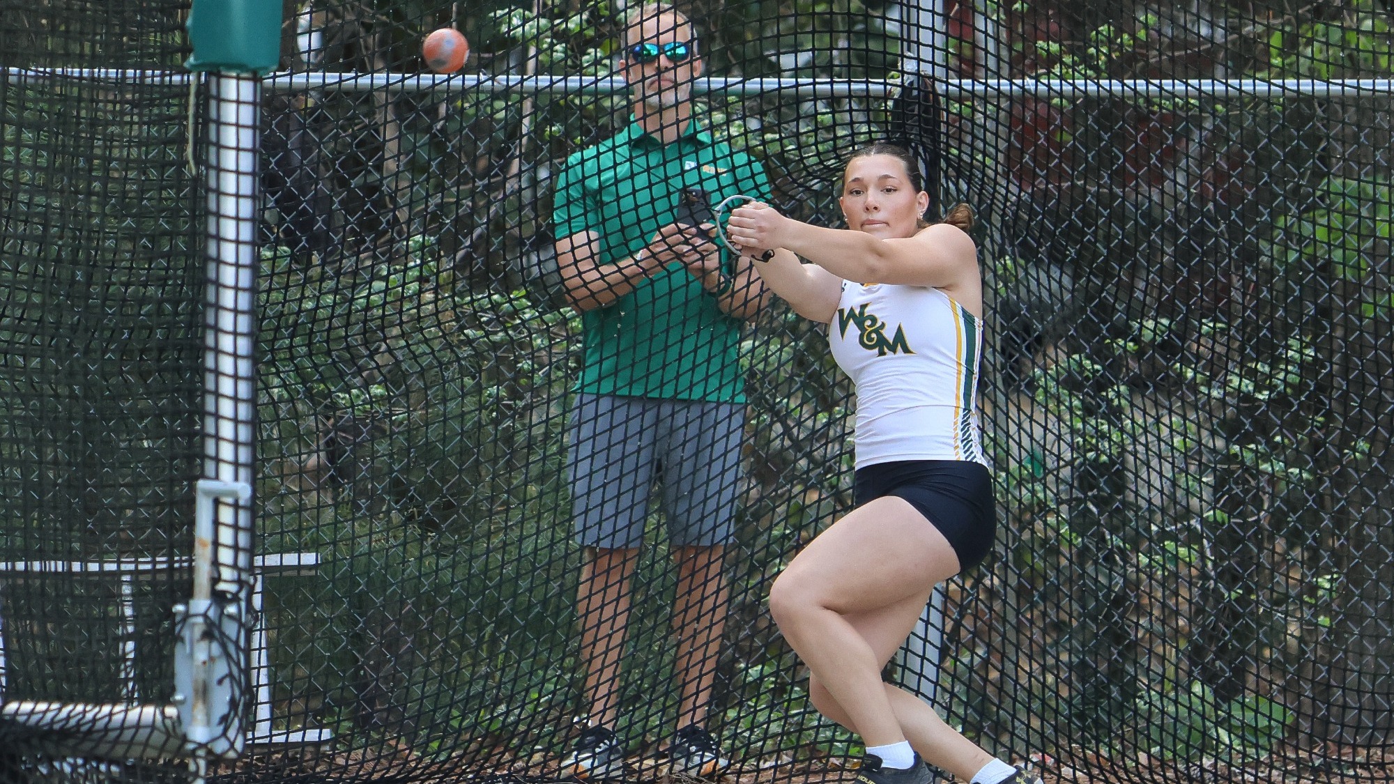 Amelia Bawcombe competing in the hammer throw