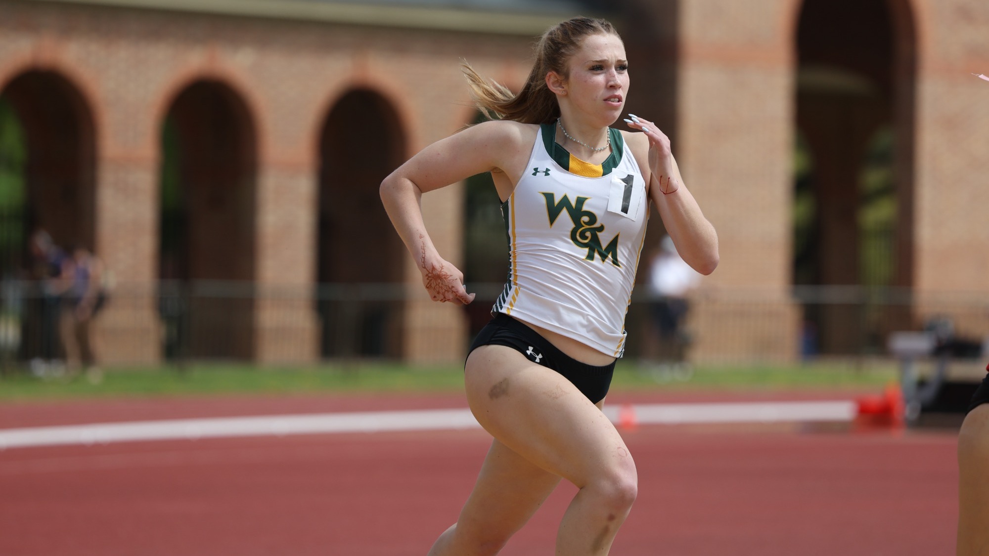 Caroline Jones running on the track