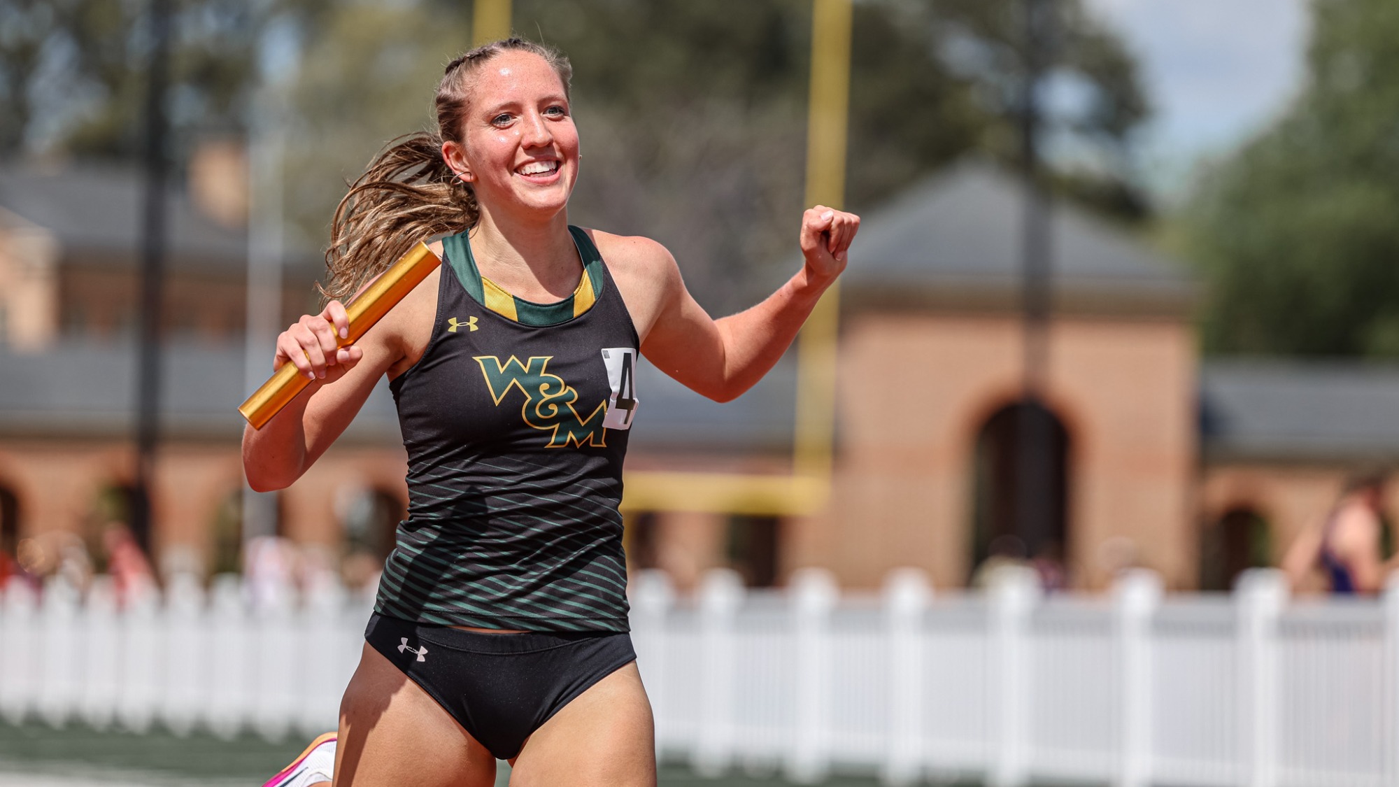Kelly Ann Sutterfield celebrating a victory on the track