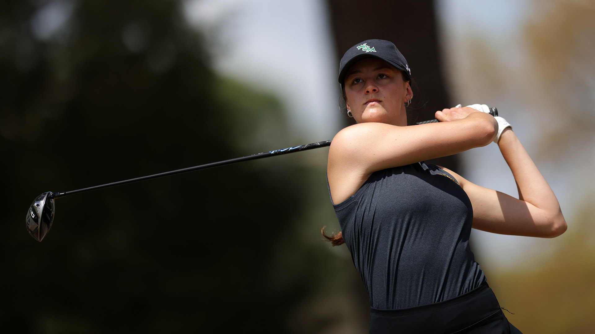 Reagan Garnsey watches her drive after following through and posing off the tee at the Carolina Challenge Cup during the practice round. 
