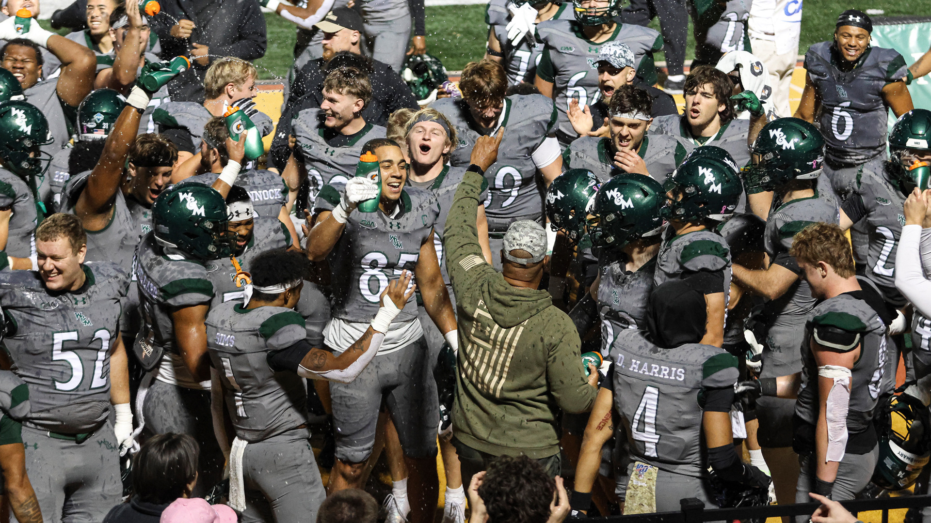 Members of the W&M football team celebrate following a win at Zable Stadium