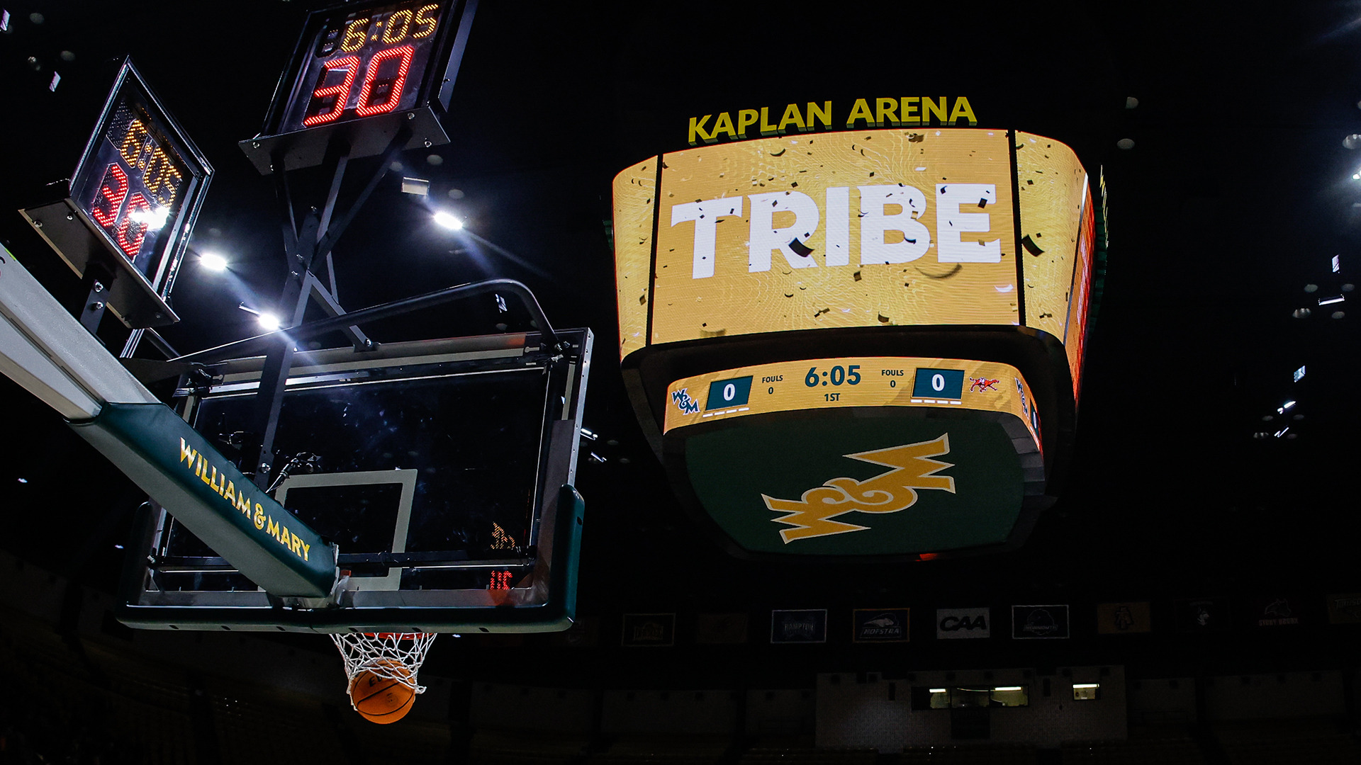 The videoboard at Kaplan Arena displays Tribe as a shot goes through the hoop during warmups at Gold Rush against Campbell in 2026. 