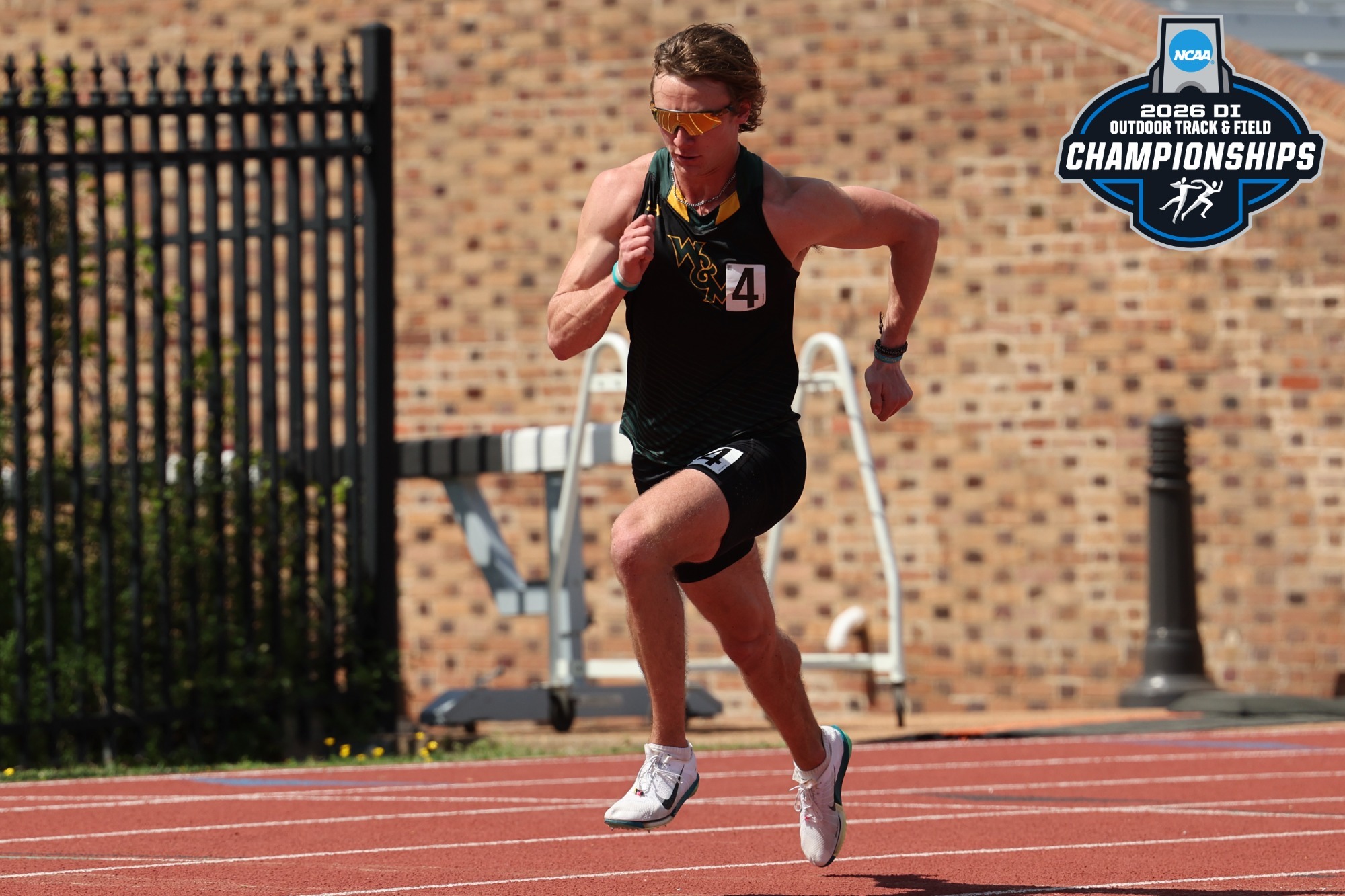Jonathan Kumer racing on the track competing in the 800m with the NCAA Championships logo in the top right