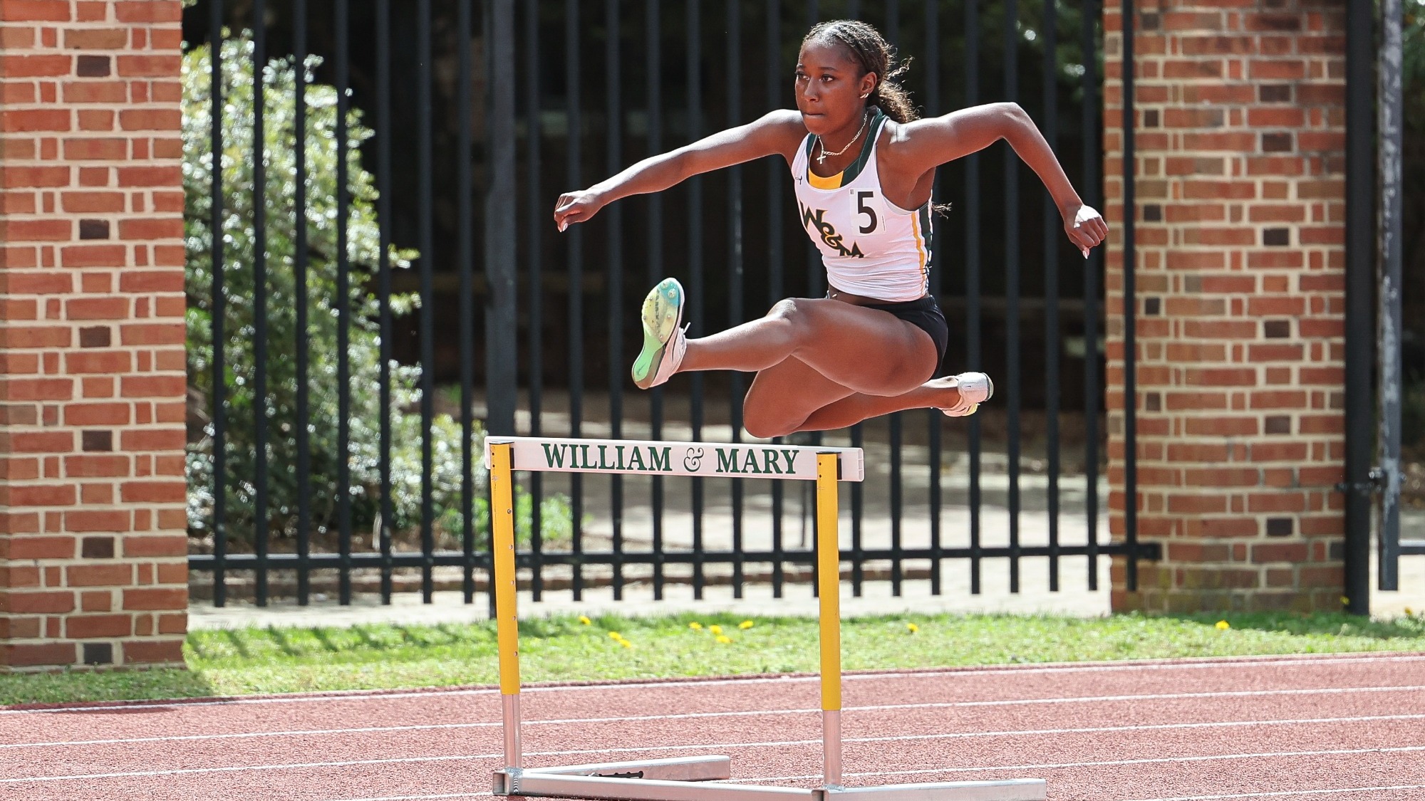 Kennedy Reynolds leaping over a hurdle
