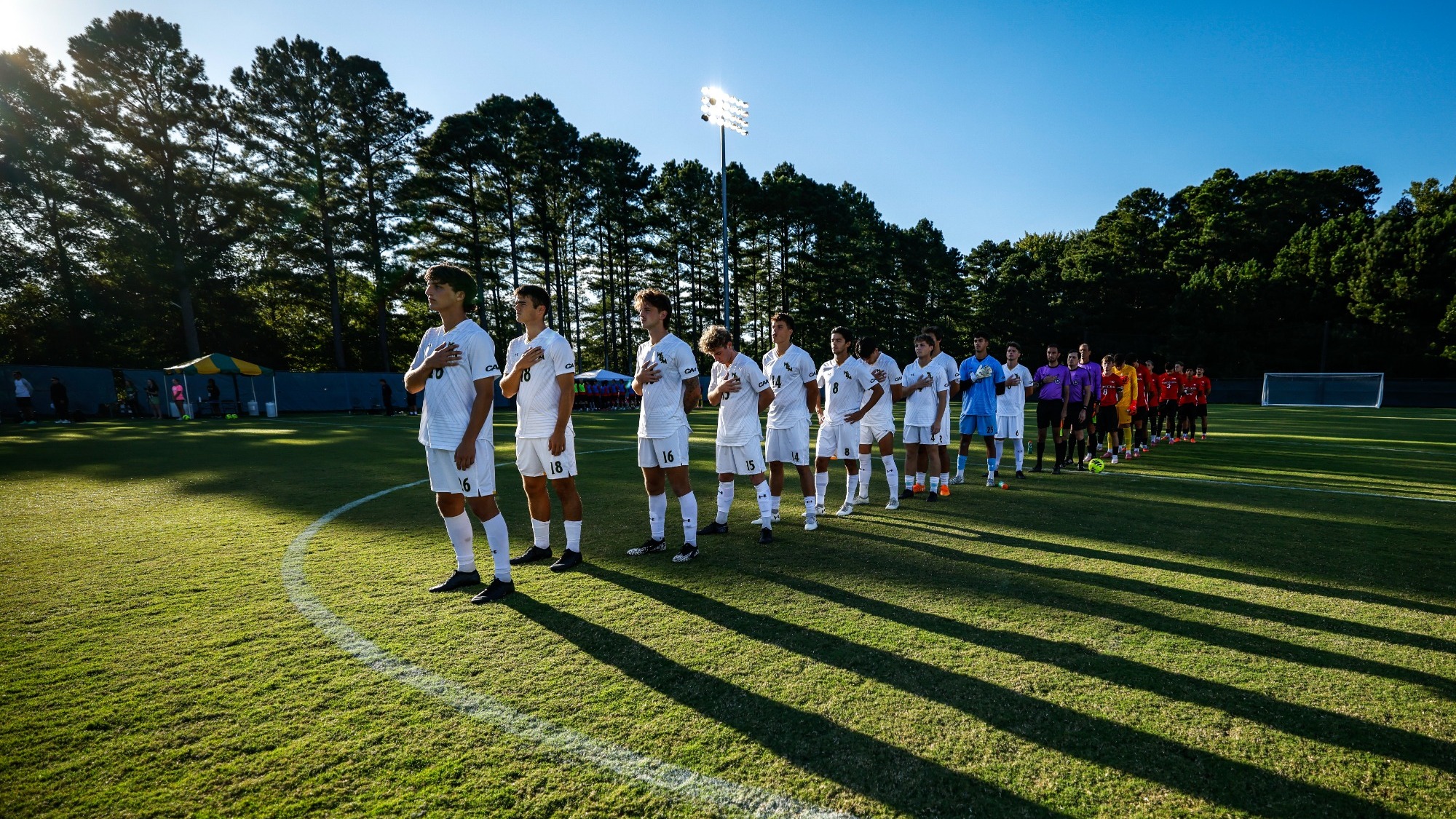 William & Mary men's soccer lined up for the national anthem before a match. 