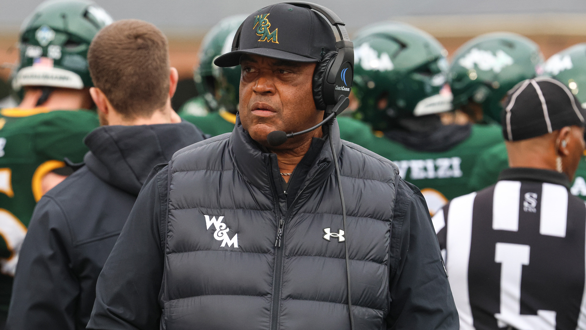 Head Coach Mike London looks towards the field wearing a headset during a home football game at Zable Stadium