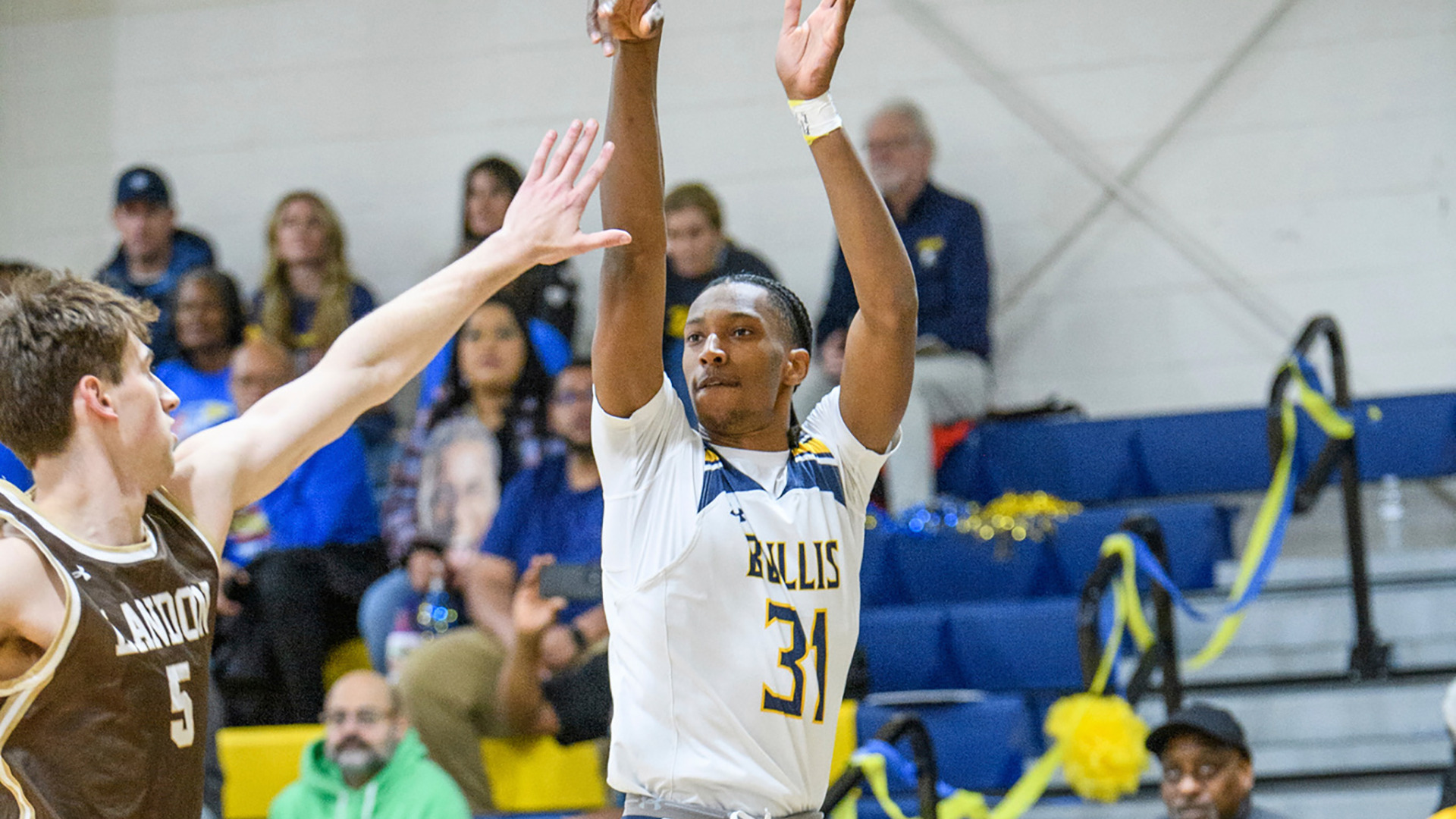 Chris Richards, playing for The Bullis School, shoot a corner 3-pointers over a defender in a game during his senior season in high school.