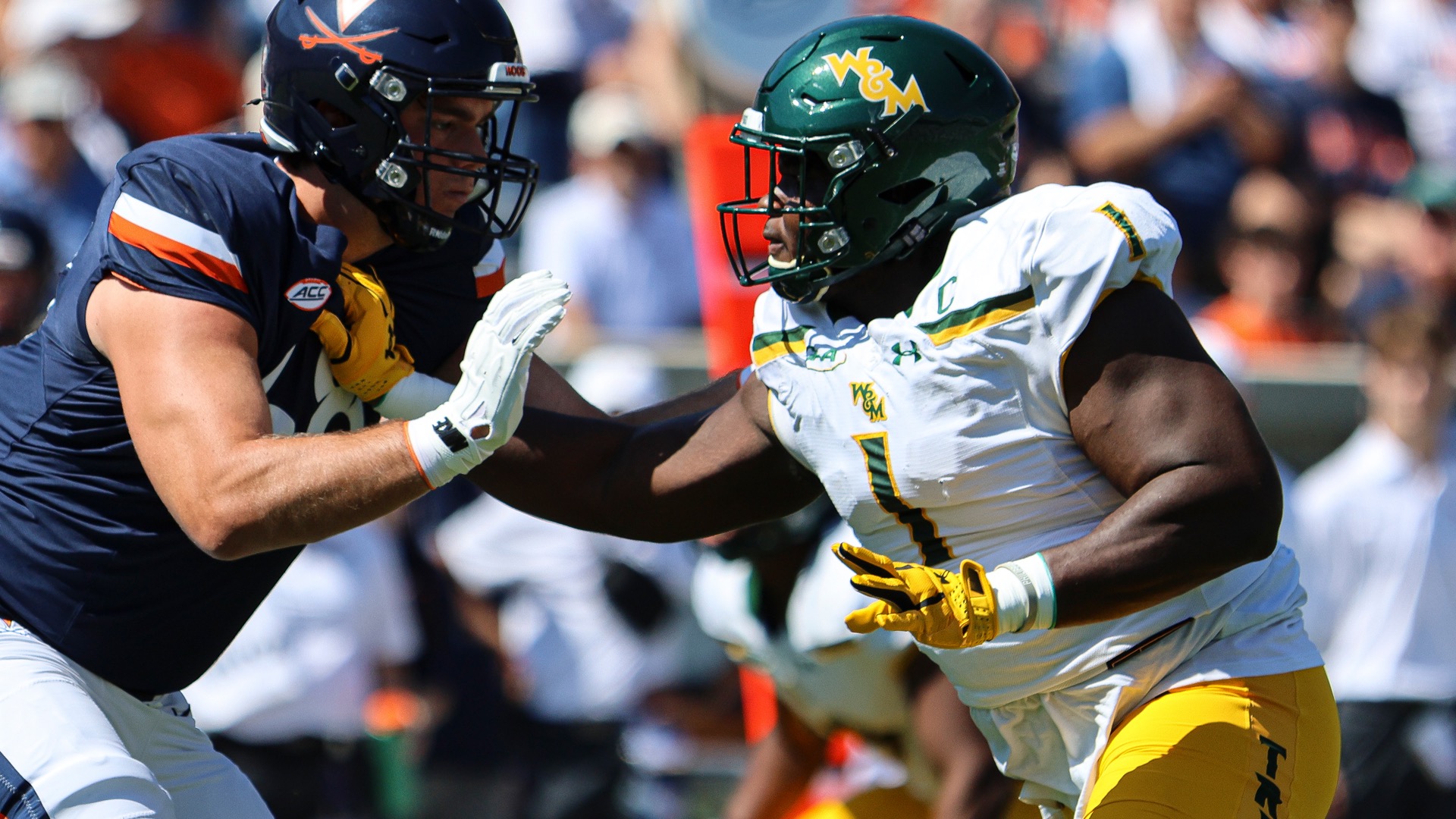 Davin Dzidzienyo rushes a towards an offensive lineman during a game at the University of Virginia during the 2025 season.