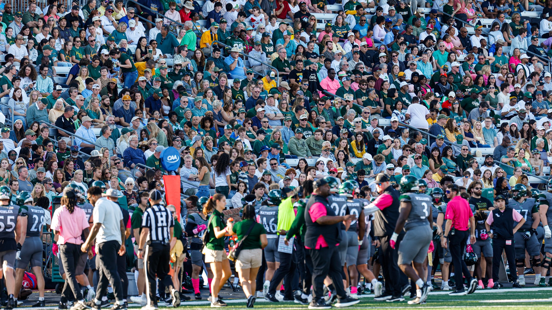 Large crowd of W&M fans behind the Tribe sideline at Zable Stadium during a game against NC A&T