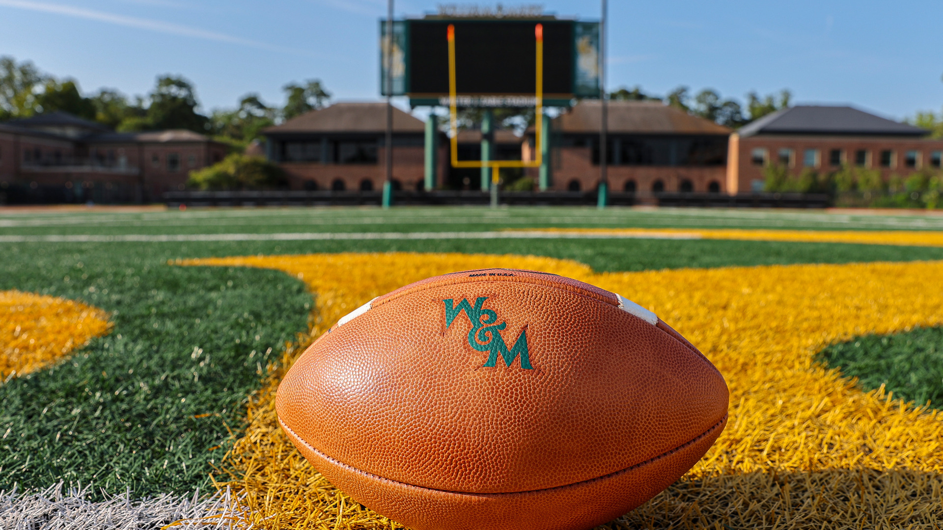 W&M football at midfield in Zable Stadium