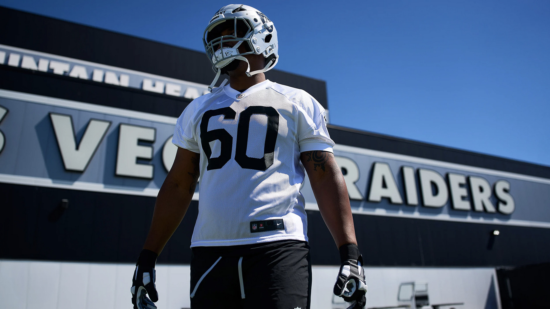 Charles Grant walks on the Las Vegas Raiders practice field.