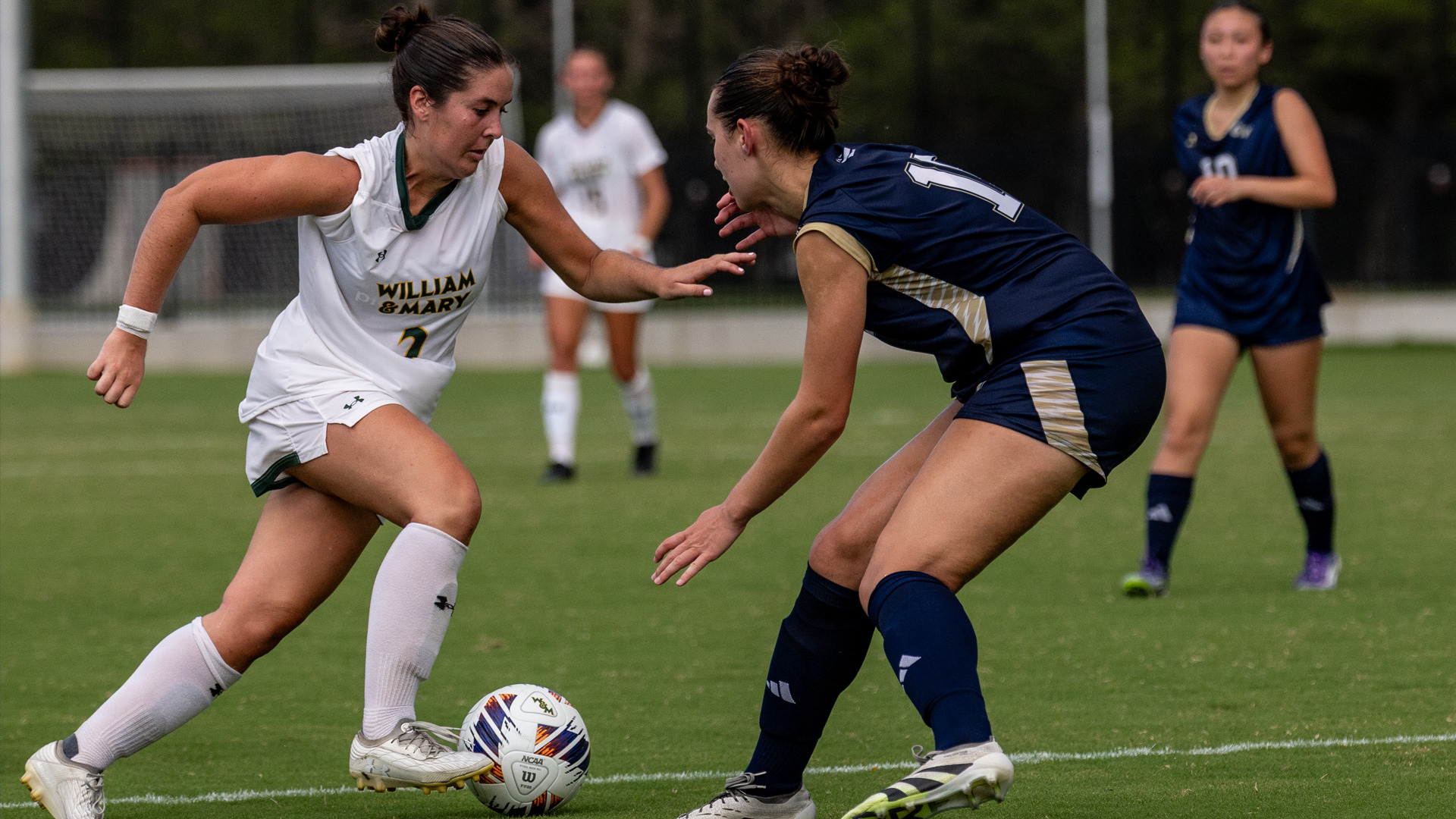 Lindsay Wilson dribbles past a GW defender