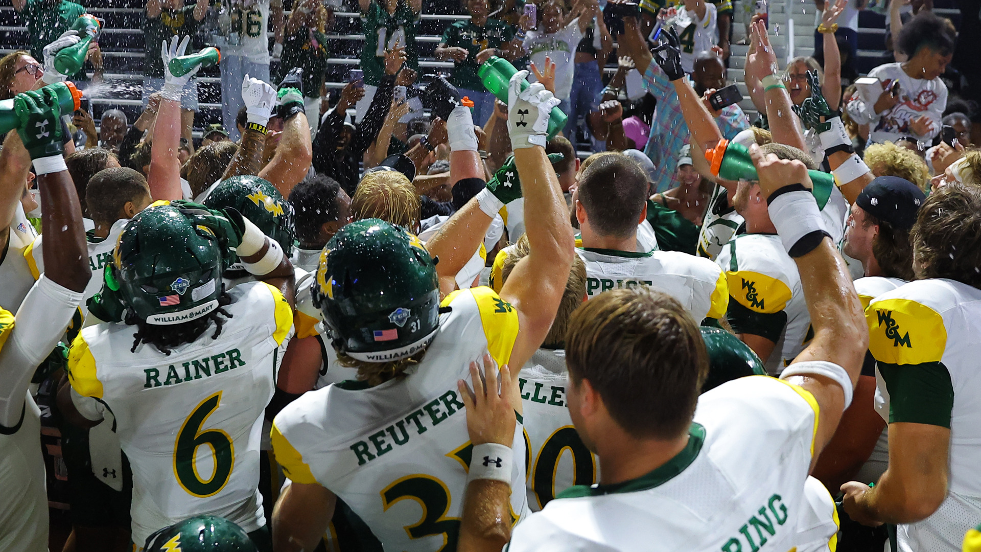 W&M Celebrates with fans following its win at Villanova