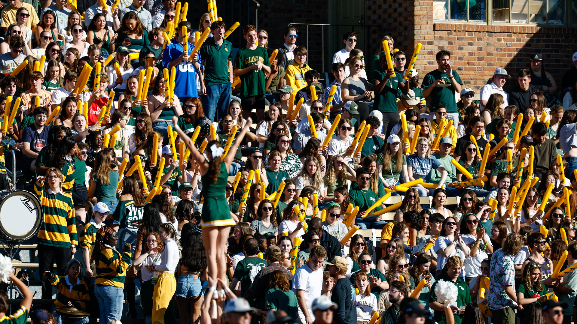 W&M student section cheering during a football game at Zable Stadium